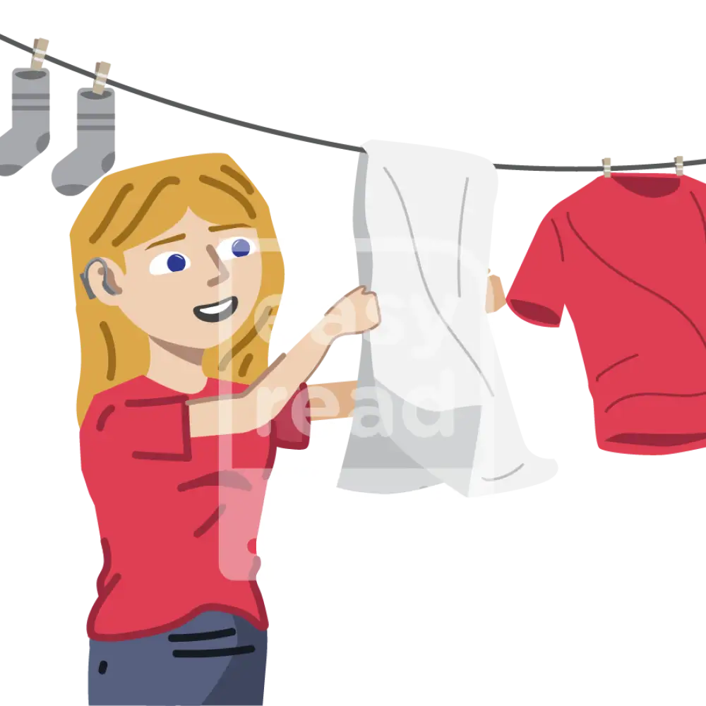 Woman Hanging Up Clothes